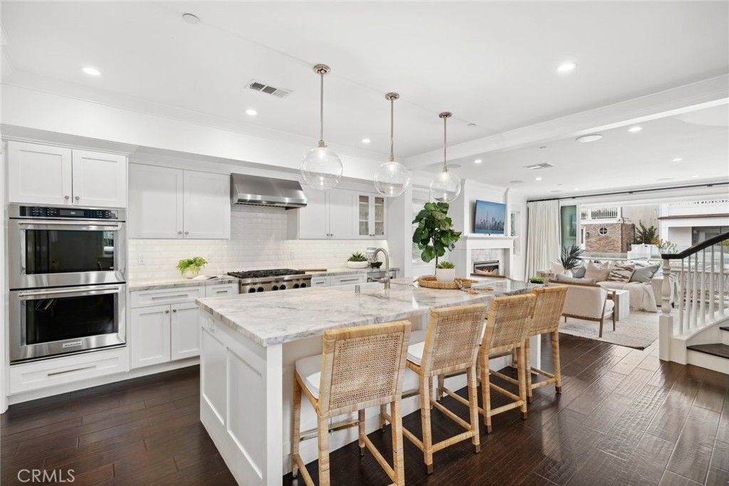 Dining room, Fireplace, Interior, Kitchen, Living room, Pendant Lights, Recessed Lighting, Stainless Steel Appliances, Wood Texture Flooring