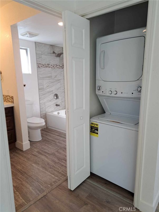 Bathroom, Interior, Marble Walls, Recessed Lighting, Utility Closets, Washer, Wood Texture Flooring