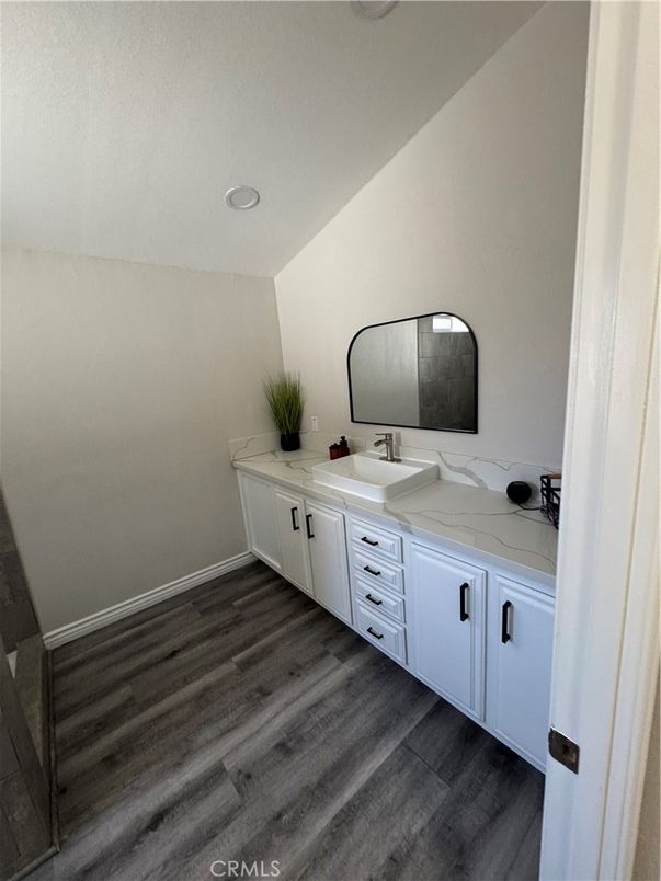 Bathroom, Dual Sink Vanities, Interior, Recessed Lighting, Wood Texture Flooring