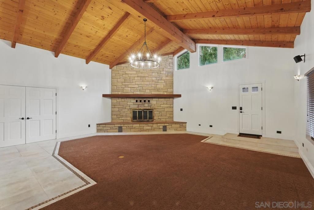 Empty room, Fireplace, Interior, Pendant Lights, Stone Walls, Wooden Beams, Wooden Ceilings