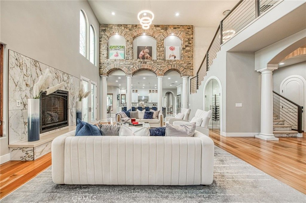 Fireplace, Interior, Living room, Recessed Lighting, Stone Walls, Wood Texture Flooring