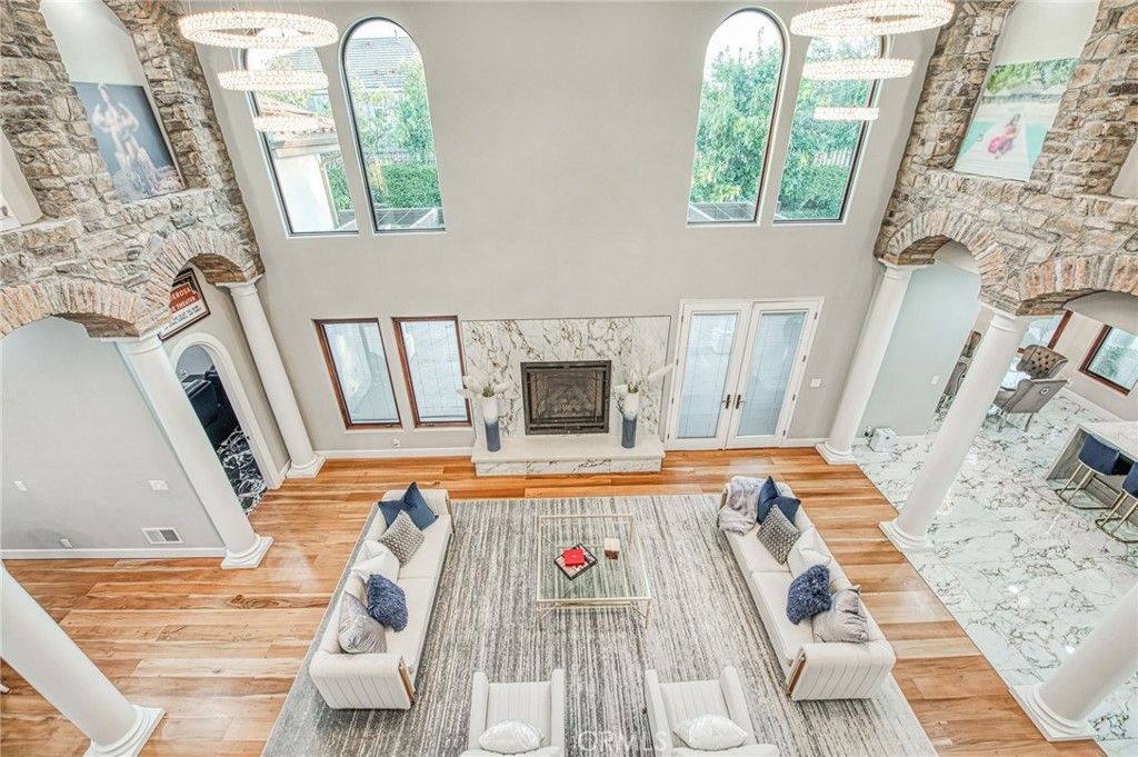 Chandelier, Fireplace, Interior, Living room, Stone Walls, Wood Texture Flooring