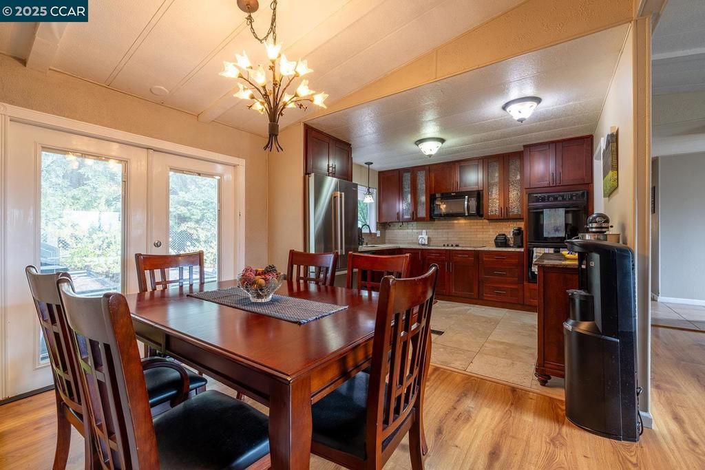 Chandelier, Dining room, Interior, Kitchen, Stainless Steel Appliances, Wood Texture Flooring
