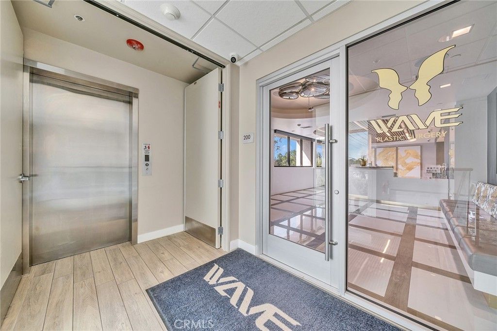 Elevator, Interior, Recessed Lighting, Wood Texture Flooring