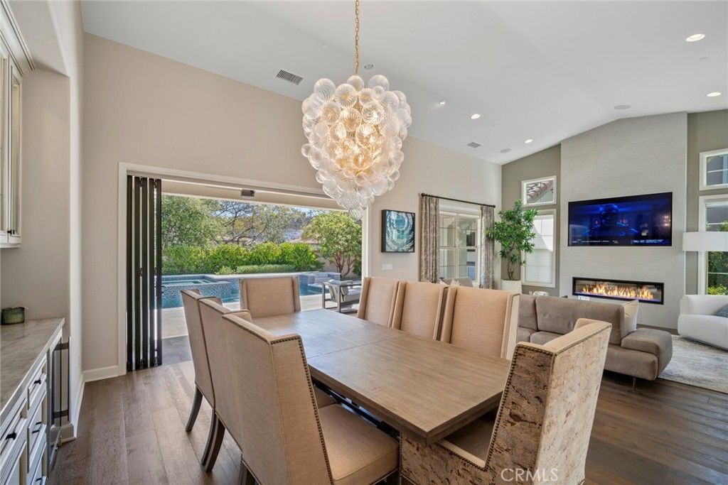 Chandelier, Dining room, Fireplace, Interior, Living room, Recessed Lighting, Wood Texture Flooring