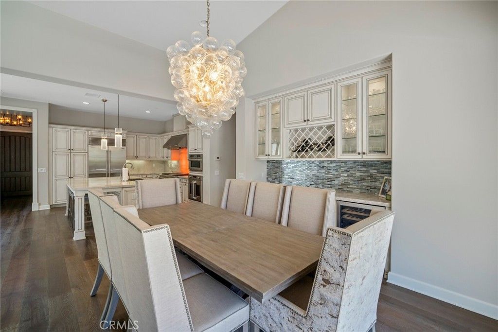 Chandelier, Dining room, Interior, Kitchen, Pendant Lights, Recessed Lighting, Stainless Steel Appliances, Wood Texture Flooring