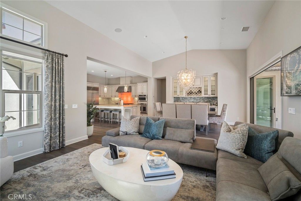 Chandelier, Dining room, Interior, Kitchen, Living room, Pendant Lights, Recessed Lighting, Stainless Steel Appliances, Wood Texture Flooring