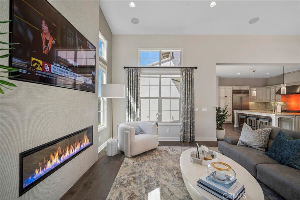 Fireplace, Interior, Kitchen, Living room, Pendant Lights, Recessed Lighting, Stainless Steel Appliances, Wood Texture Flooring