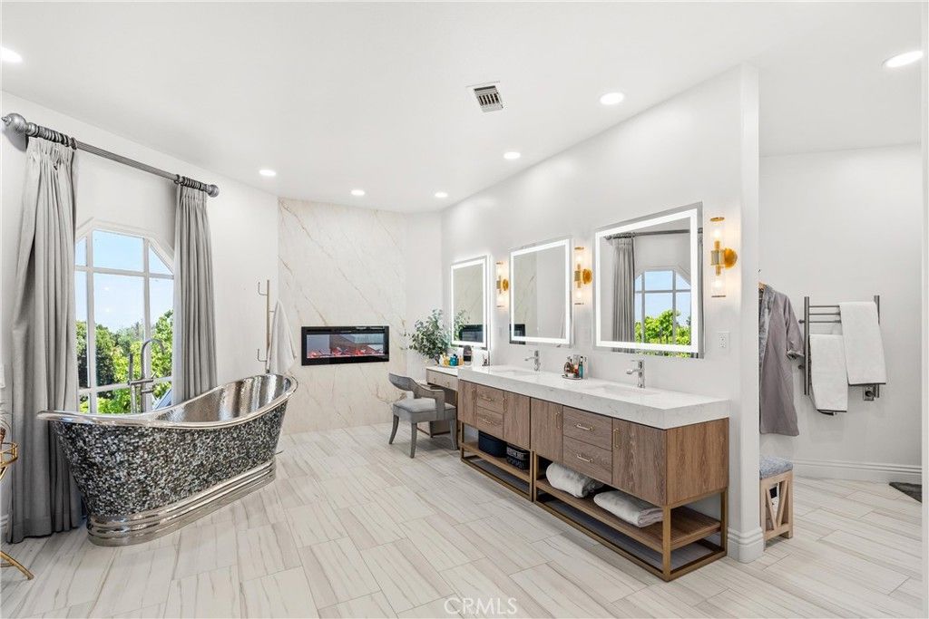 Bathroom, Dual Sink Vanities, Interior, Marble Walls, Recessed Lighting, Wood Texture Flooring