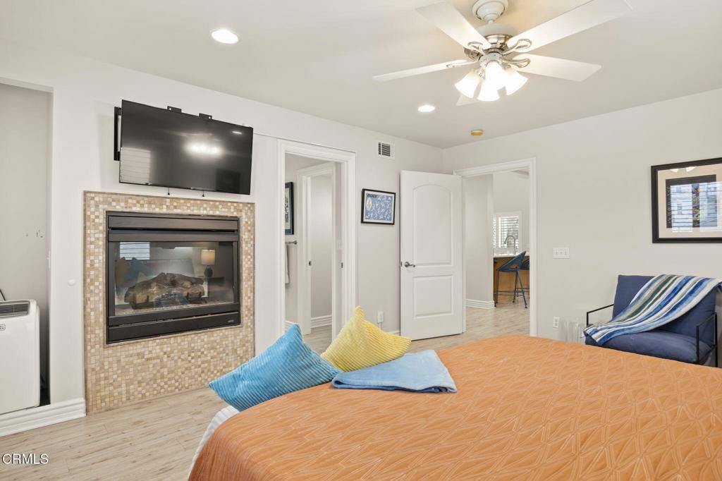 Bedroom, Fireplace, Interior, Recessed Lighting, Wood Texture Flooring