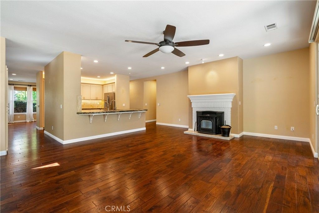 Empty room, Fireplace, Interior, Kitchen, Recessed Lighting, Wood Texture Flooring