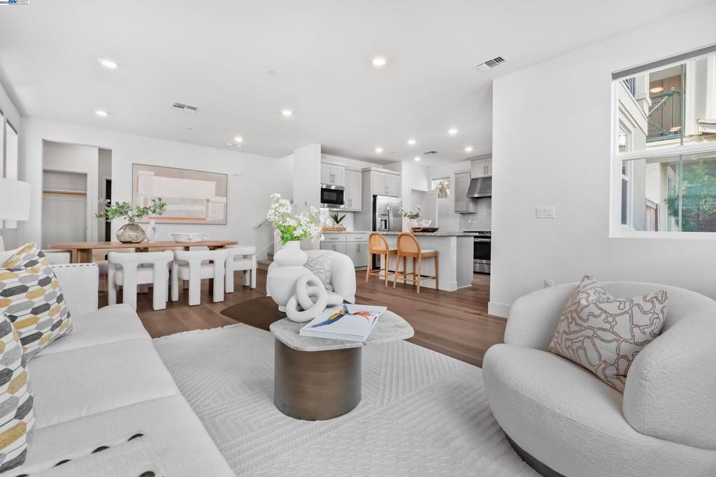 Dining room, Interior, Kitchen, Living room, Recessed Lighting, Stainless Steel Appliances, Wood Texture Flooring