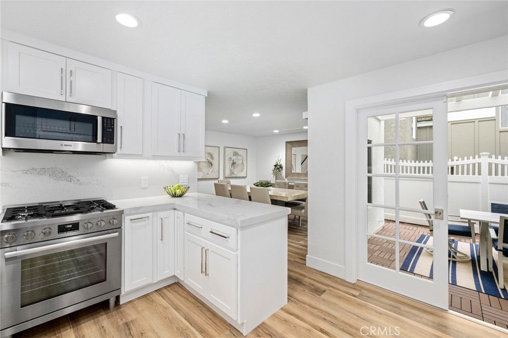 Dining room, Interior, Kitchen, Recessed Lighting, Stainless Steel Appliances, Wood Texture Flooring