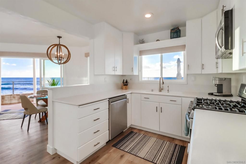 Chandelier, Dining room, Interior, Kitchen, Pendant Lights, Recessed Lighting, Stainless Steel Appliances, Water, Wood Texture Flooring