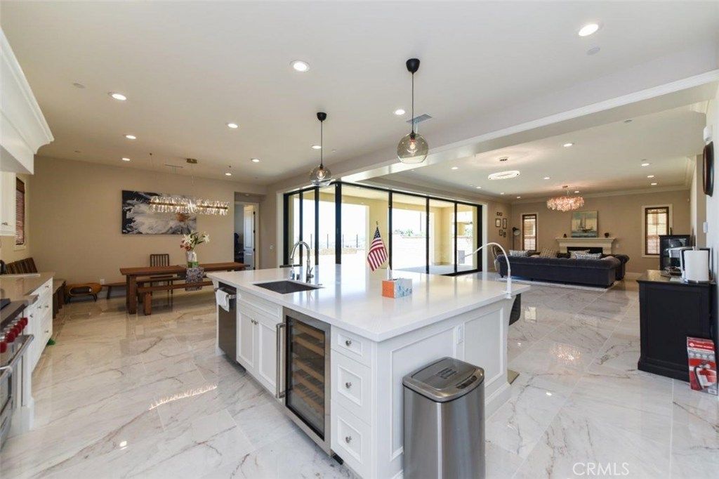 Chandelier, Dining room, Interior, Kitchen, Living room, Marble, Pendant Lights, Recessed Lighting, Stainless Steel Appliances