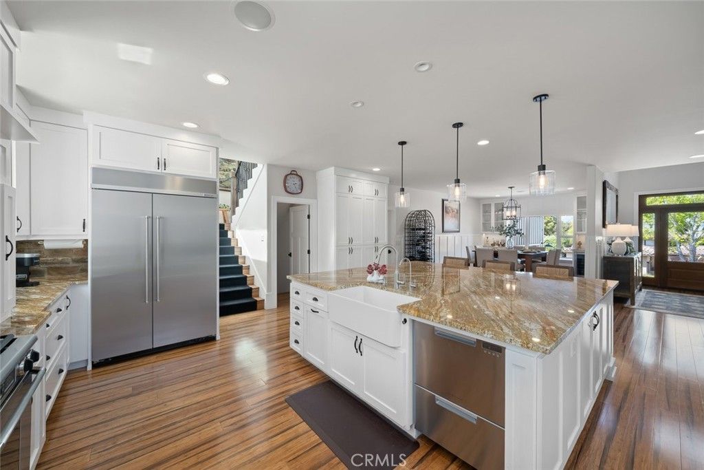 Dining room, Interior, Kitchen, Pendant Lights, Recessed Lighting, Stainless Steel Appliances, Wood Texture Flooring