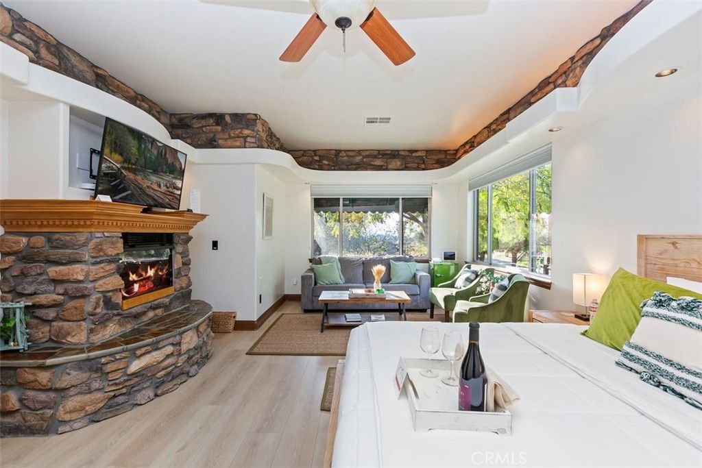 Fireplace, Interior, Living room, Recessed Lighting, Stone Walls, Wood Texture Flooring