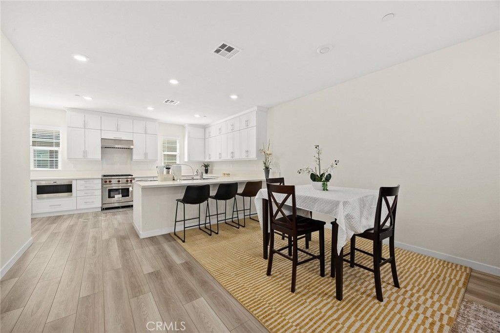 Dining room, Interior, Kitchen, Recessed Lighting, Stainless Steel Appliances, Wood Texture Flooring