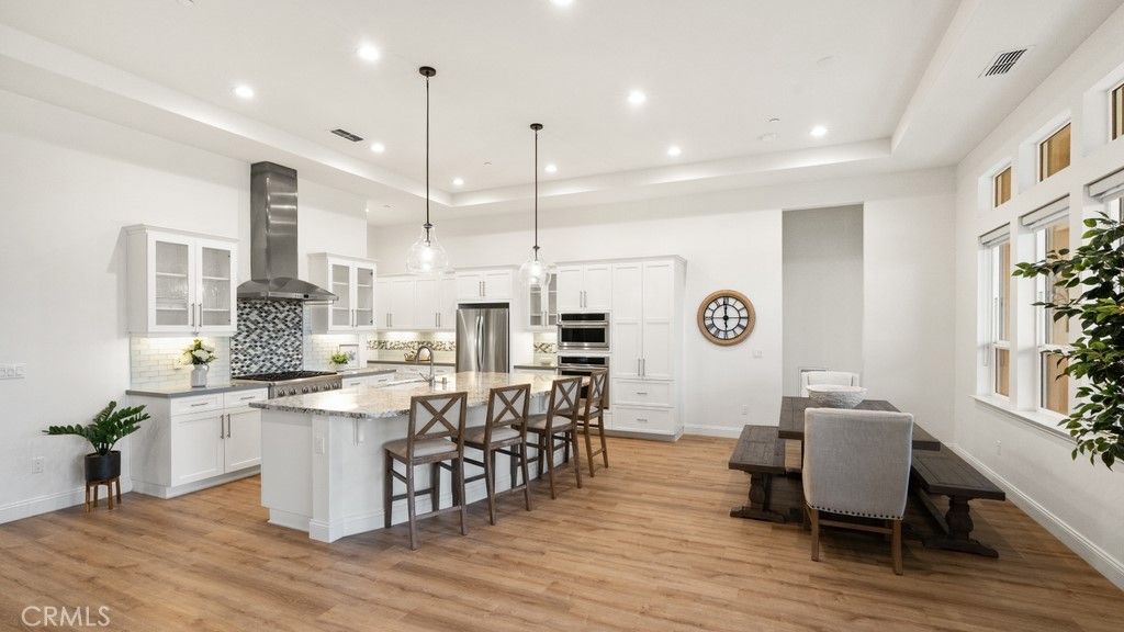 Dining room, Interior, Kitchen, Pendant Lights, Recessed Lighting, Stainless Steel Appliances, Wood Texture Flooring