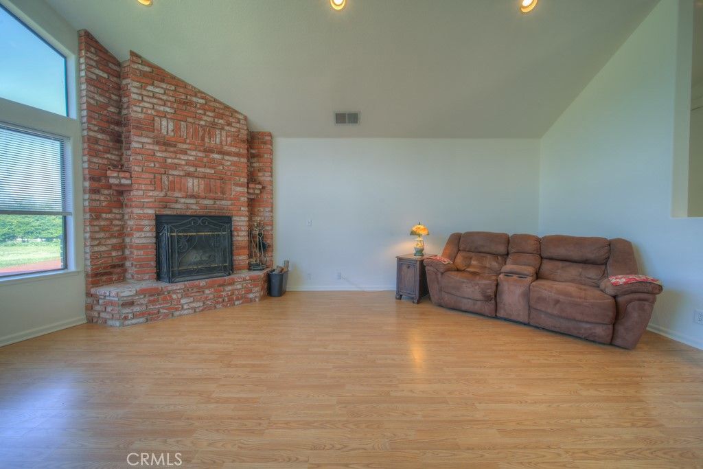Empty room, Fireplace, Interior, Recessed Lighting, Stone Walls, Wood Texture Flooring