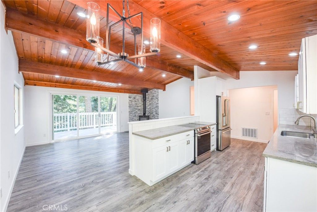 Fireplace, Interior, Kitchen, Recessed Lighting, Stainless Steel Appliances, Stone Walls, Wooden Beams, Wooden Ceilings, Wood Texture Flooring