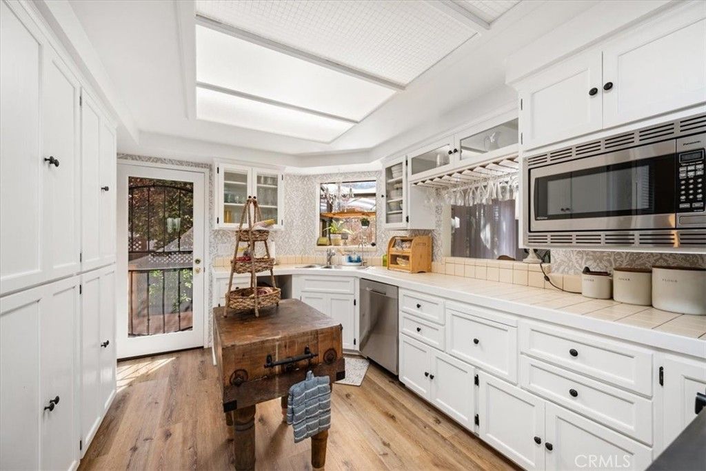 Interior, Kitchen, Stainless Steel Appliances, Tile Countertops, Wood Texture Flooring