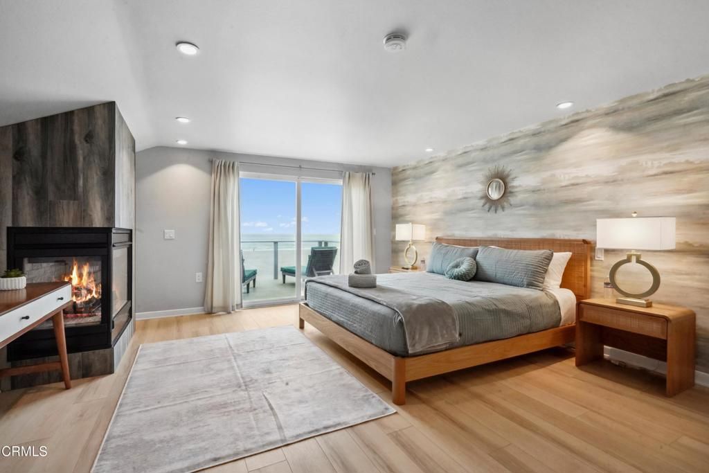 Bedroom, Fireplace, Interior, Recessed Lighting, Water, Wood Texture Flooring