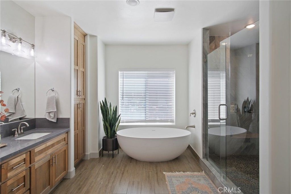 Bathroom, Dual Sink Vanities, Free Standing Baths, Glass Shower, Interior, Recessed Lighting, Wood Texture Flooring