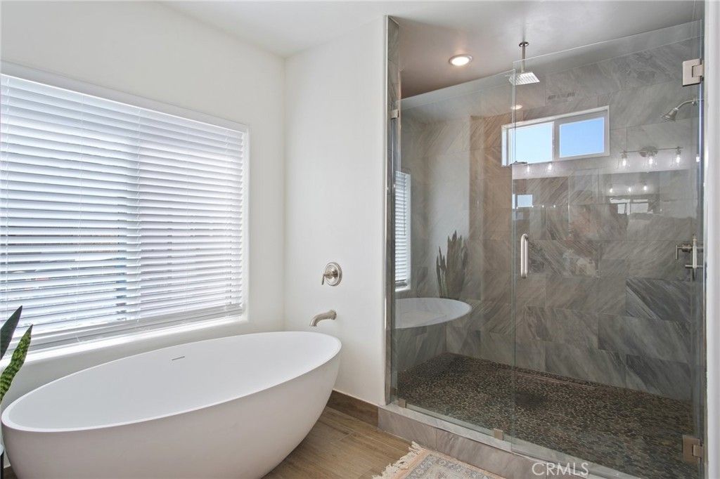 Bathroom, Free Standing Baths, Glass Shower, Interior, Marble Walls, Recessed Lighting, Wood Texture Flooring