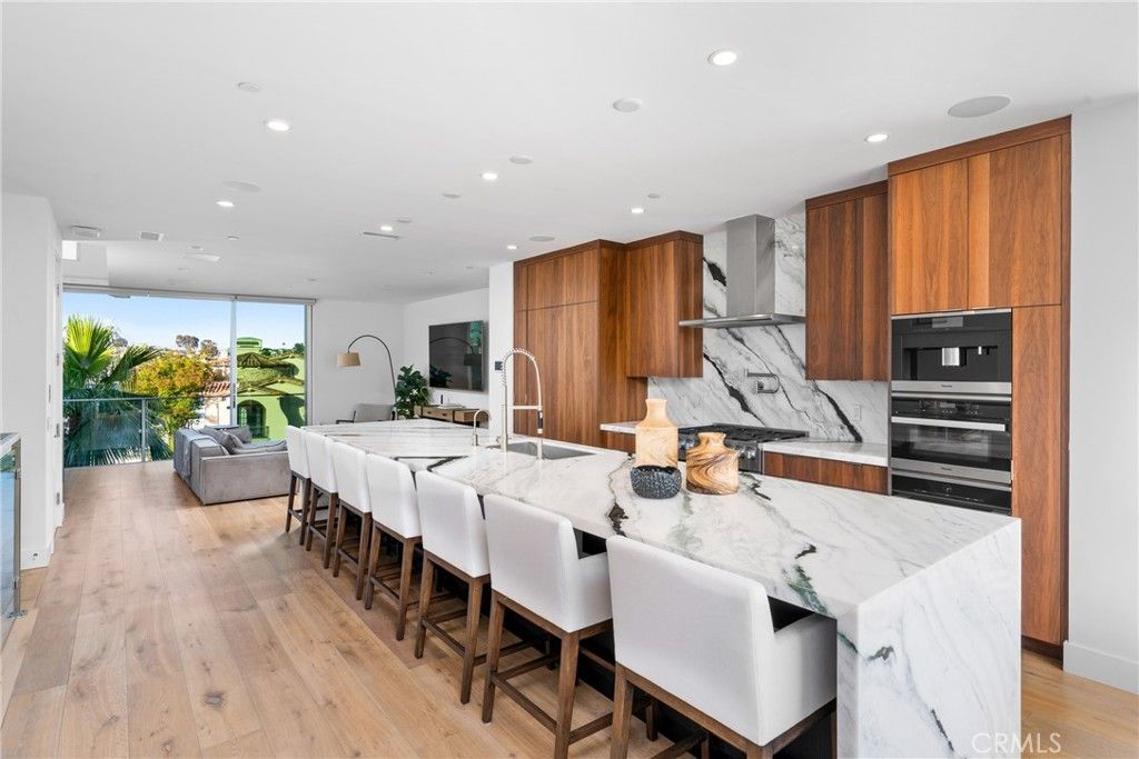 Interior, Kitchen, Marble Walls, Recessed Lighting, Stainless Steel Appliances, Wood Texture Flooring