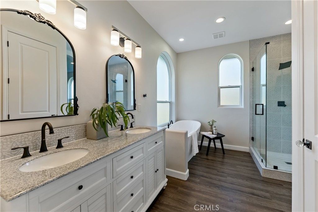 Bathroom, Dual Sink Vanities, Glass Shower, Interior, Recessed Lighting, Wood Texture Flooring