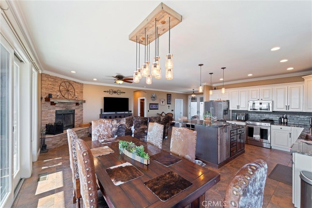 Dining room, Fireplace, Interior, Kitchen, Pendant Lights, Recessed Lighting, Stainless Steel Appliances, Stone Walls