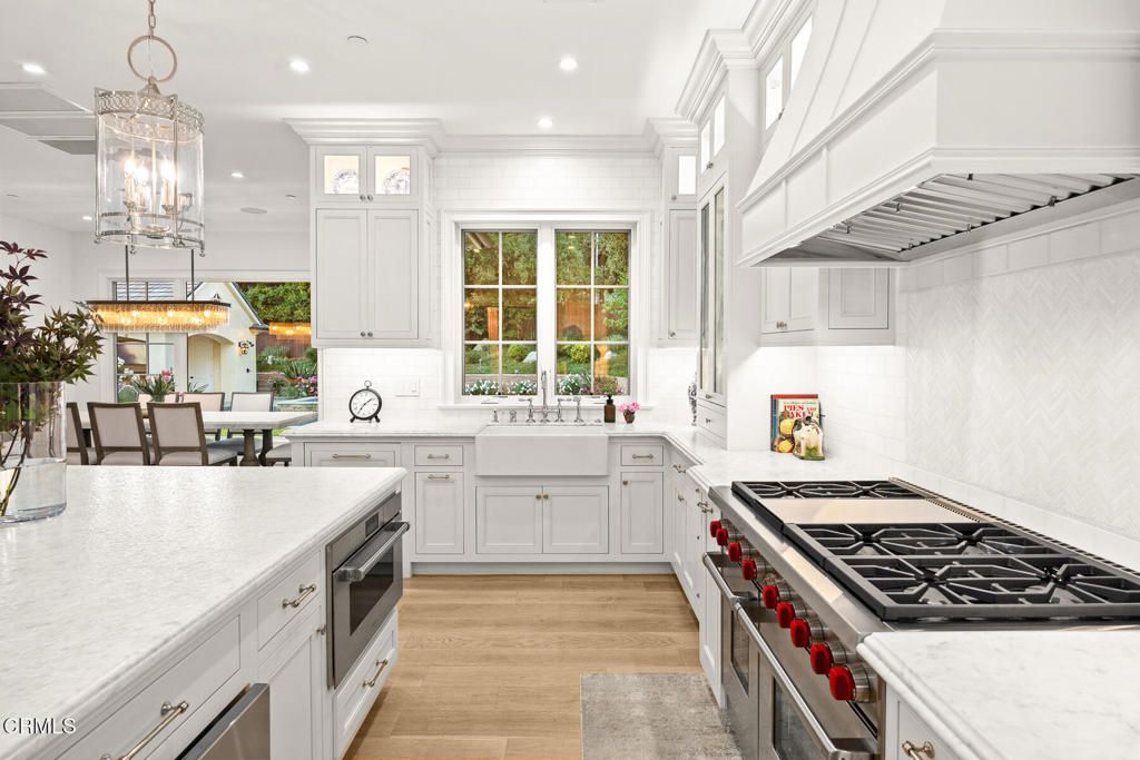 Chandelier, Dining room, Interior, Kitchen, Pendant Lights, Recessed Lighting, Stainless Steel Appliances, Wood Texture Flooring