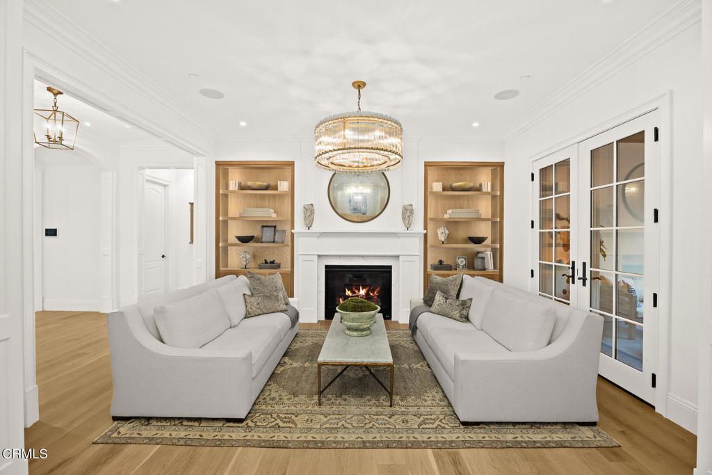 Chandelier, Fireplace, Interior, Living room, Pendant Lights, Recessed Lighting, Wood Texture Flooring