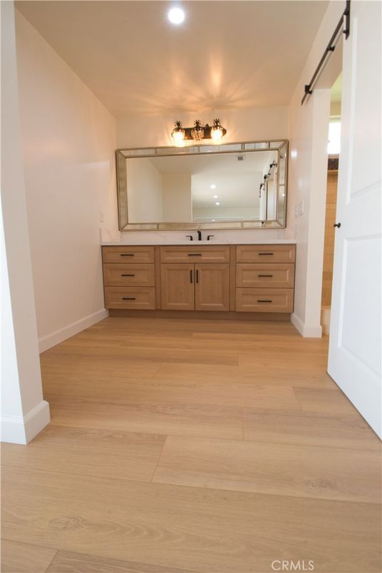 Bathroom, Dual Sink Vanities, Interior, Recessed Lighting, Wood Texture Flooring