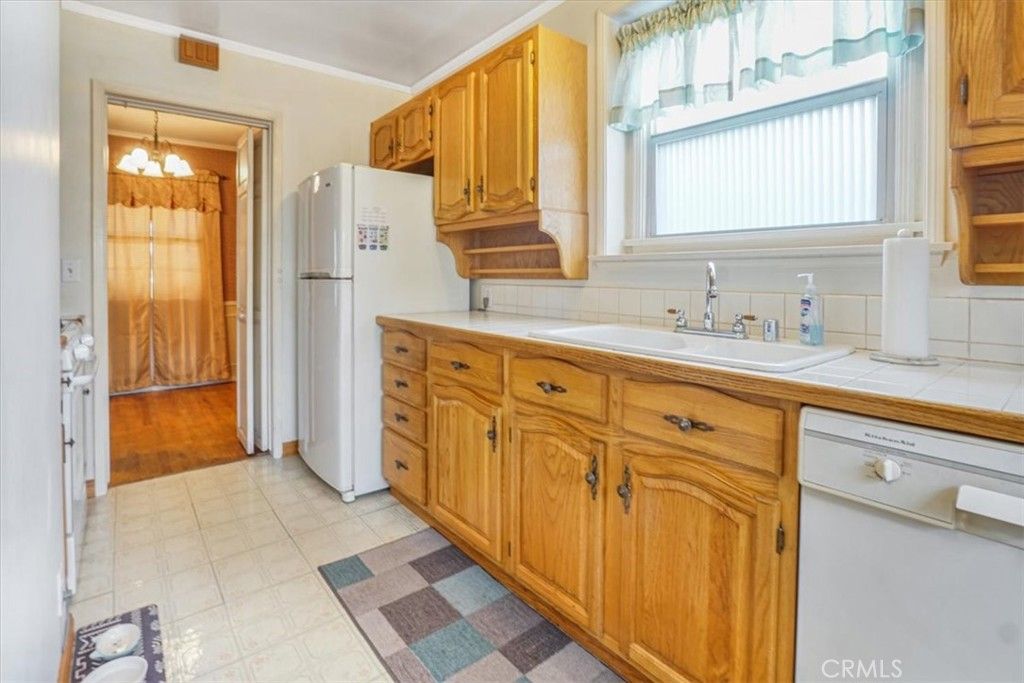 Interior, Kitchen, Pendant Lights, Tile Countertops, Wood Texture Flooring