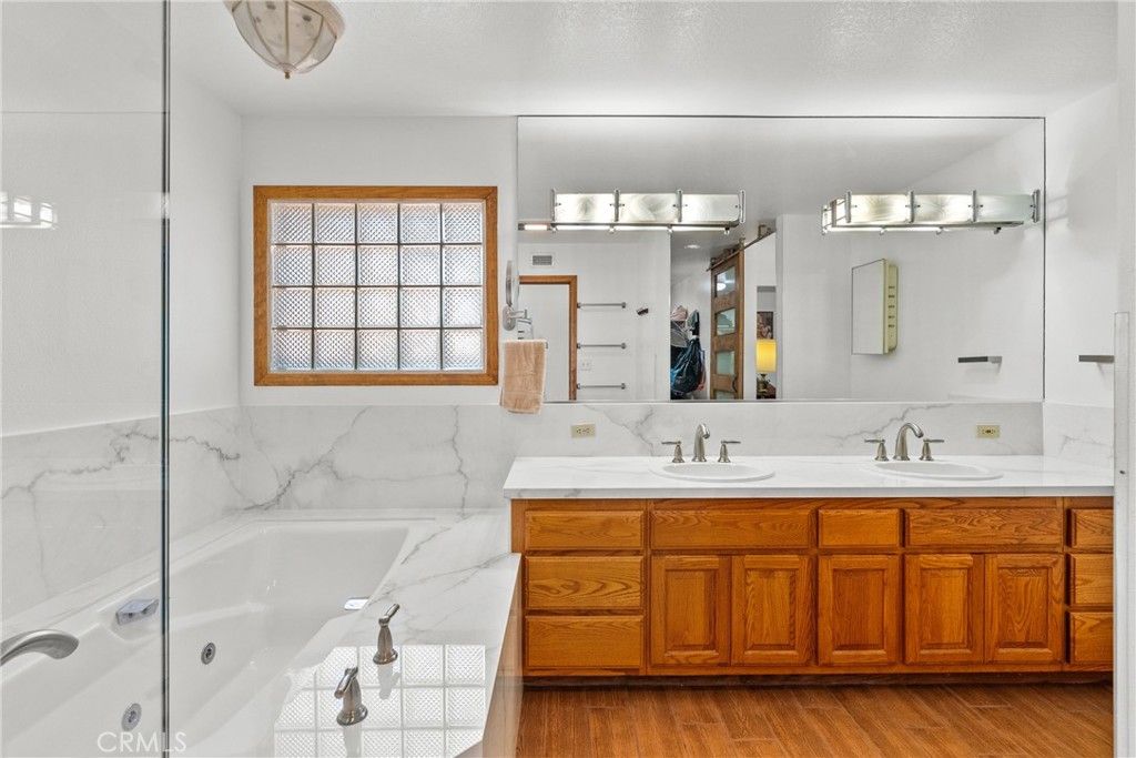 Bathroom, Dual Sink Vanities, Interior, Marble Walls, Wood Texture Flooring