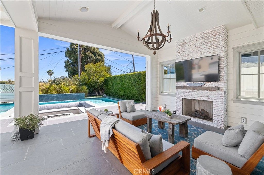 Chandelier, Fireplace, Interior, Living room, Pool, Stone Walls