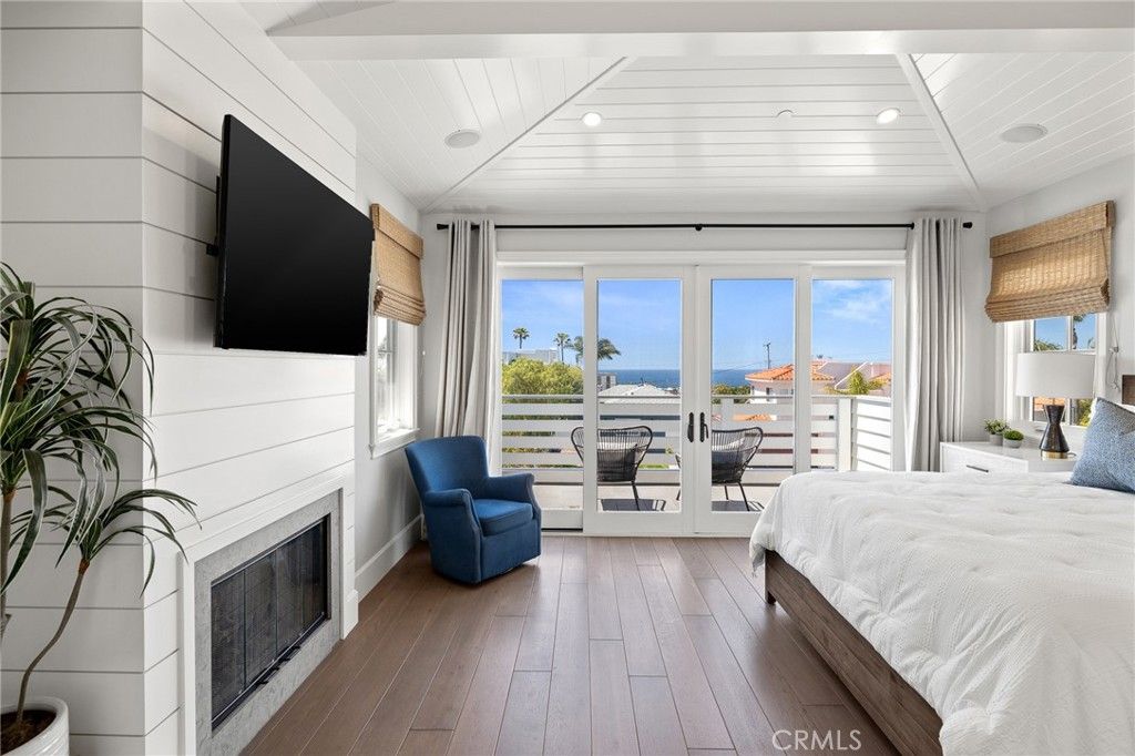 Bedroom, Fireplace, Interior, Recessed Lighting, Water, Wood Texture Flooring
