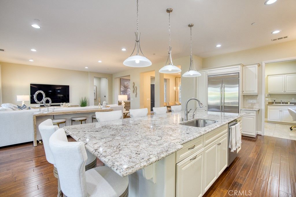 Dining room, Interior, Kitchen, Living room, Pendant Lights, Recessed Lighting, Stainless Steel Appliances, Wood Texture Flooring