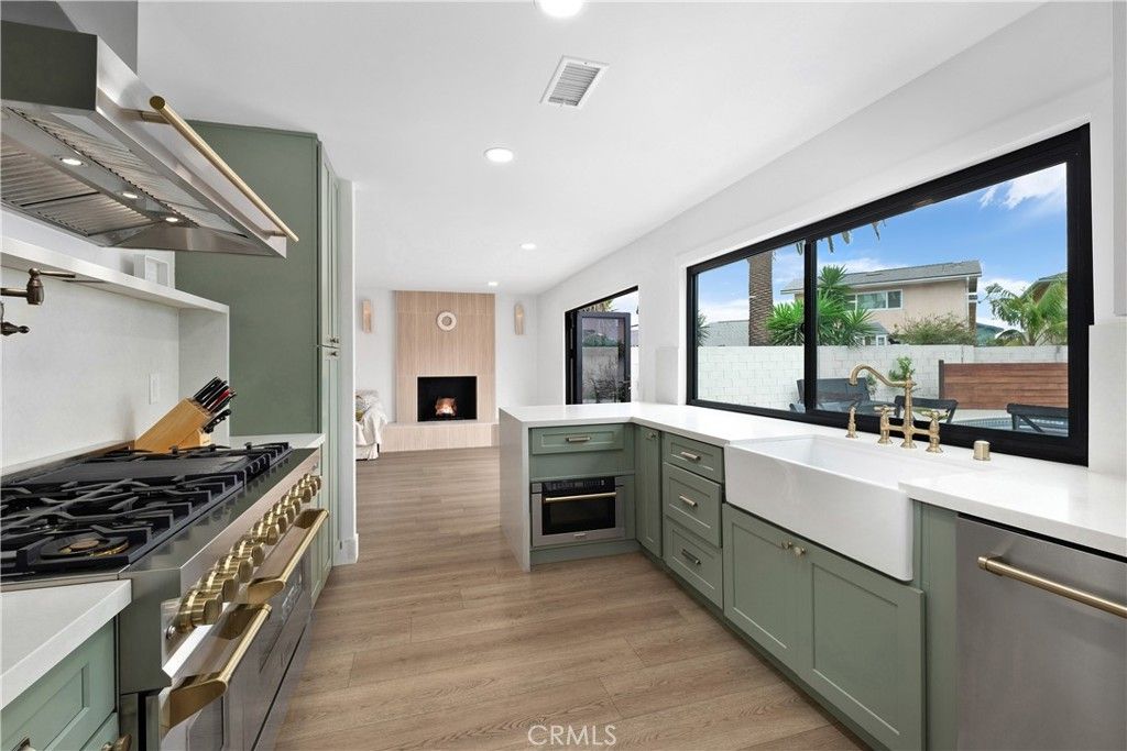 Fireplace, Interior, Kitchen, Recessed Lighting, Stainless Steel Appliances, Wood Texture Flooring