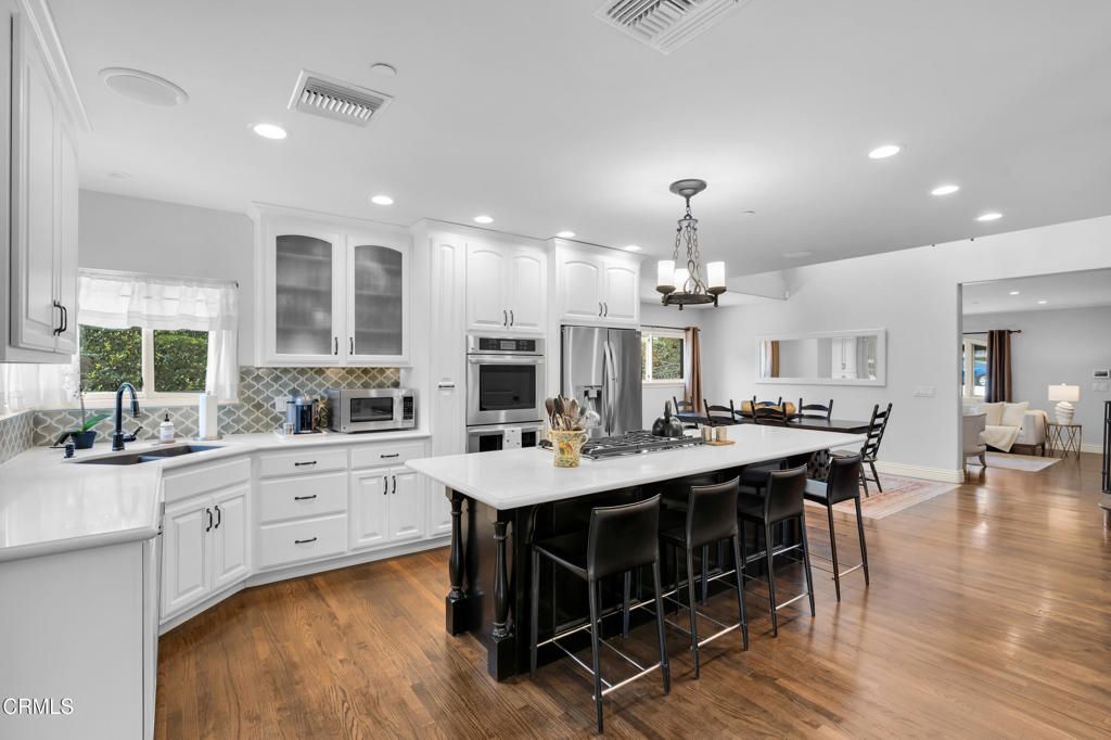 Dining room, Interior, Kitchen, Recessed Lighting, Stainless Steel Appliances, Wood Texture Flooring