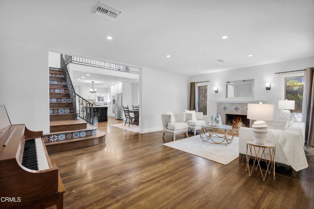 Dining room, Fireplace, Interior, Living room, Piano, Recessed Lighting, Wood Texture Flooring