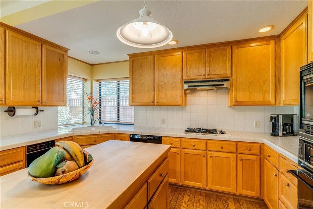 Interior, Kitchen, Pendant Lights, Recessed Lighting, Tile Countertops, Wood Texture Flooring