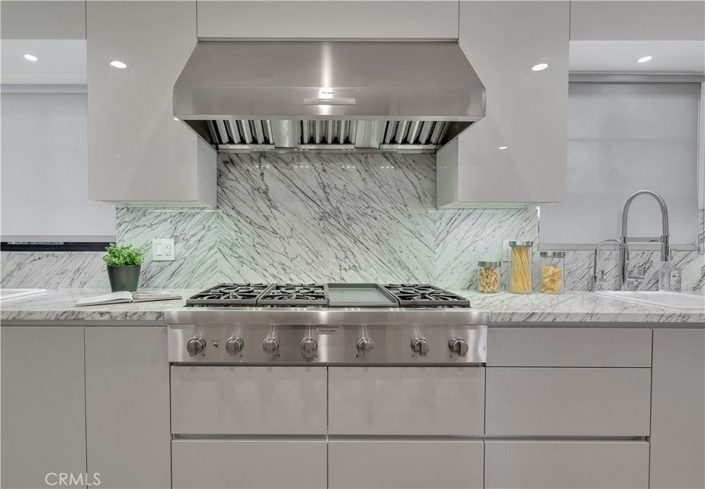 Interior, Kitchen, Marble Walls, Recessed Lighting, Stainless Steel Appliances