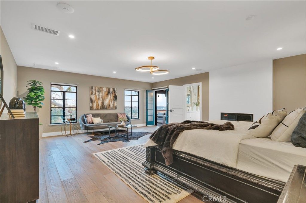 Bedroom, Fireplace, Interior, Pendant Lights, Recessed Lighting, Wood Texture Flooring