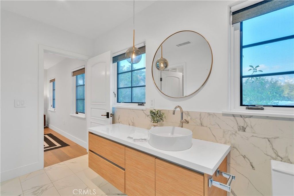 Bathroom, Dual Sink Vanities, Interior, Marble, Marble Walls, Pendant Lights, Wood Texture Flooring