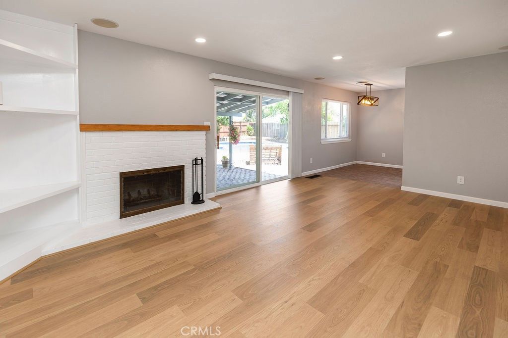 Empty room, Fireplace, Interior, Pendant Lights, Recessed Lighting, Wood Texture Flooring