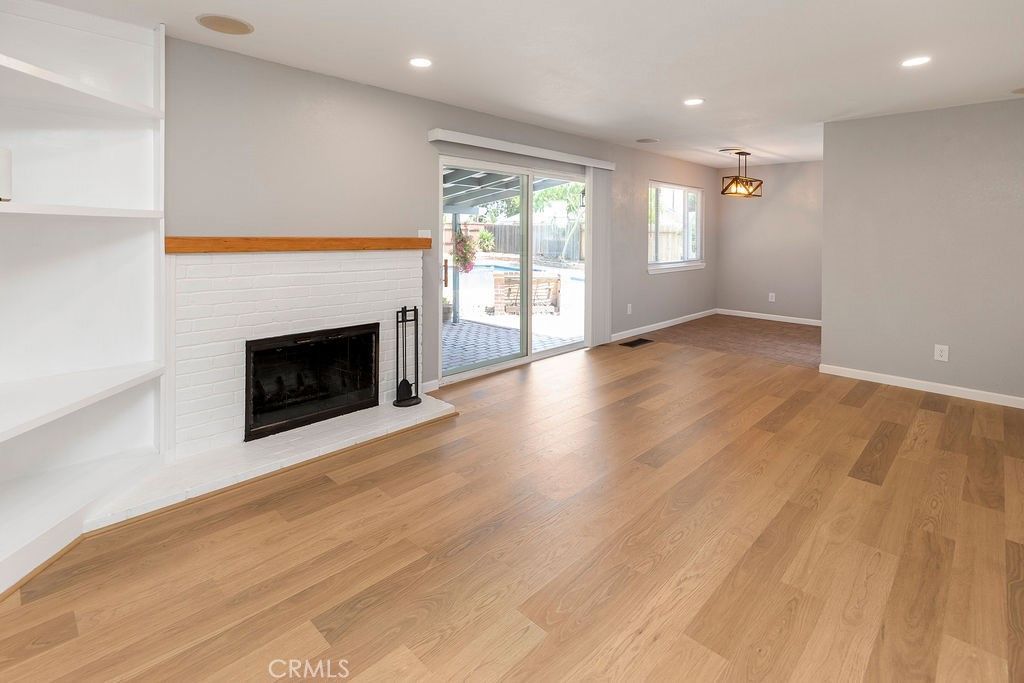 Empty room, Fireplace, Interior, Pendant Lights, Recessed Lighting, Wood Texture Flooring
