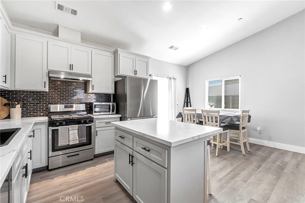 Dining room, Interior, Kitchen, Recessed Lighting, Stainless Steel Appliances, Wood Texture Flooring
